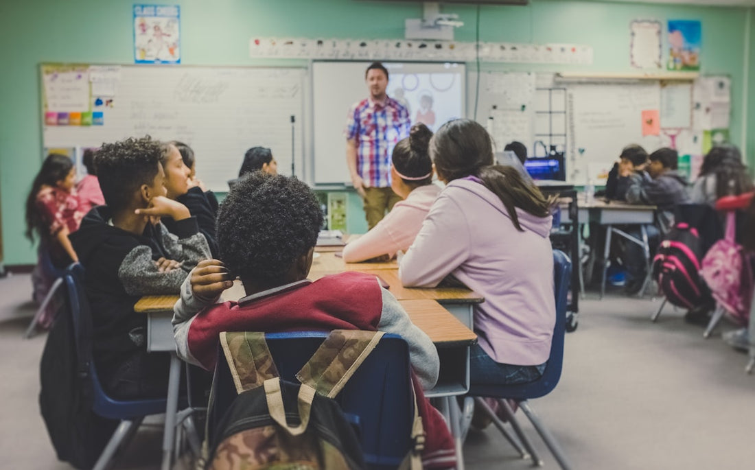 Teacher presenting to engaged students — the pre-film activity